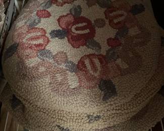 large assortment of wool hooked seat pads and rugs