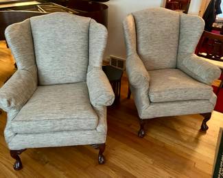 A pair of finely made upholstered armchairs.