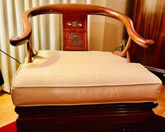 A pair of Chinese horseshoe back chairs.