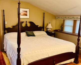 Large king size traditional four poster bed .