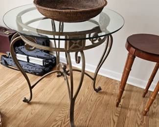 Metal table w/glass top, round wood table, basket, (items sold separately).