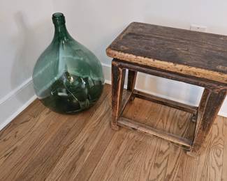 Large wine jar and primitive table.