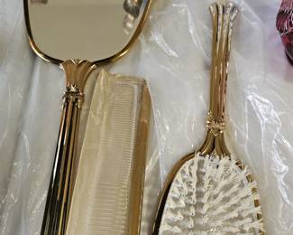 Comb, brush and mirror set.