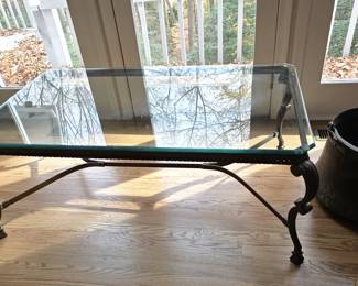 Glass top metal coffee table.