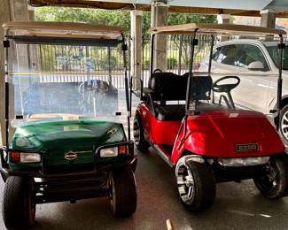 Green 2002 EZGO Workhorse 1200 gas cart with electric dump bed. Robin engine. Runs great. Well maintained.

Red 2005 EZGO TXT electric golf cart with rear seat and charger. New custom low-profile tires. Trojan batteries. New seat covers.


