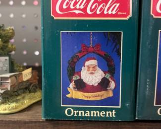 There is a nice collection of Coca Cola items including ornaments and more