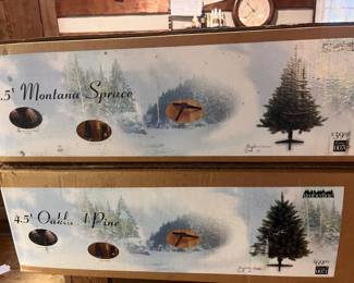 There are 3 New in the Box 4.5 Ft. Christmas Trees