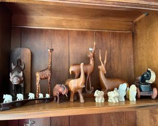 Various wooden carved animals and quartz carved animals, ebony and bone carved elephants, wooden boar bookends