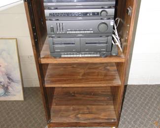 Yup, in working condition, stereo components and cabinet