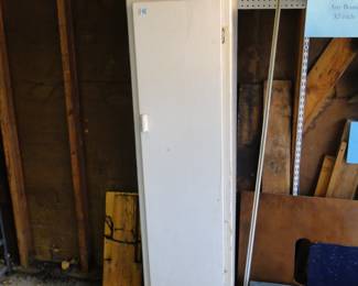 Tall wooden storage cabinet