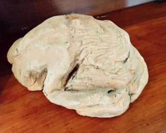 WOMAN CURLED ON ROCK IN CLAY VINTAGE