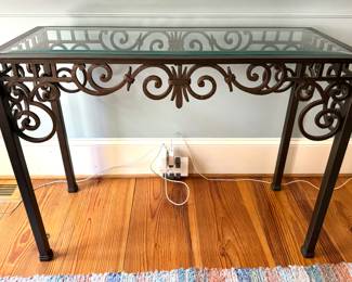Metal console table with glass top
