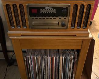 Small table, albums and Detrola radio 