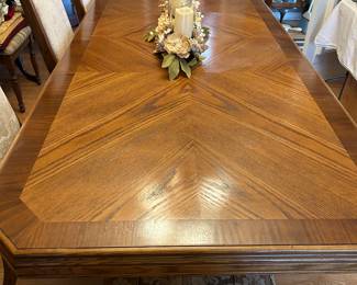 Large dining table with one leaf in as pictured and 8 chairs