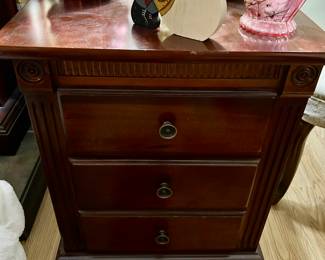 One of two end tables with two drawers. Bottom drawer is larger and made to look like two drawers. 