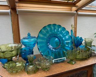 Fostoria Green Glass Liberty & Eagle Coin Footed Compote Bowl, Fostoria Green Glass Liberty & Eagle Coin Candy Dish,  Fostoria Green Glass Liberty & Eagle Coin Candlestick Holder, Green Glass Creamer, Blue Glass Grape Pattern Covered Candy Dish, Blue Depression Glass Platter, Indiana Glass Daisy Green Sugar Dish, Fostoria Green Glass Liberty & Eagle Coin Oval Bowl