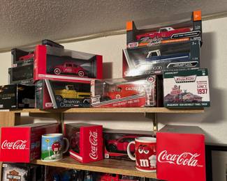 Coca Cola 1966 Volkswagen Beetle 1:24 Scale Die Cast Replica, Motor Max American Classics 1958 Chevy Apache Pickup 1:24 Die Cast Replica, MotorMax Timeless Legends 1956 Ford Thunderbird Coupe 1:24 Die Cast Replica, Motor Max American Classics 1966 Chevy C10 Fleetside Pickup 1:24 Die Cast Replica, 1939 Caltex Chevrolet Panel Truck Red Running on Empty Series 1/24 Diecast Model, Greenlight 1939 Krispy Kreme Doughnuts Chevy Panel Truck 1:64 Diecast Model, 1917 Coca Cola Ford Model T Cargo Van 1:24 Model, Motor Max 2017 Ford F-150 Raptor 1:24 Die Cast Model, 2002 M&Ms Golfing Coffee Mug, 2002 Red M&M Coffee Mug