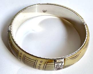 Brighton Carved Bracelet With Metal Details
Lot #: 12