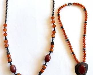 2 Vintage Amber Beaded Necklaces With Pendants: Sterling Silver & Carved Monkey
Lot #: 131