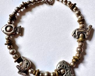 Sterling Silver Mexican Charm Bracelet
Lot #: 60