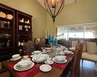 English oak solid wood dining table with pullout extensions and 8 chairs.