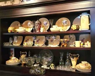 Server with grape motif glasses and dishes 