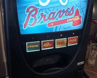 Atlanta Braves Five Foot Storage Container looks like a Soda Machine. This Drink Fridge needs some freon or other maintenance to get the refrigerator working, but at this price, it still makes an awesome mancave light! Needs interior cleaning.