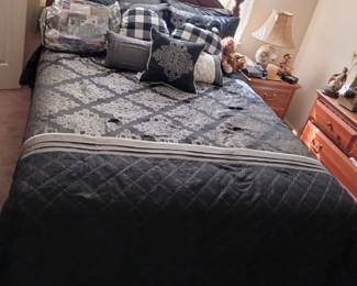 Queen Bed.  Bedding sold separately includes decorative pillows