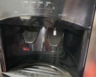 Frigidaire side by side refrigerator with ice and water in the door