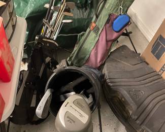 Three sets of golf clubs with bags 