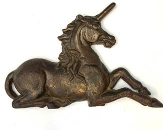 Lot # 70	$400.00	RECUMBENT STYLISED ARMORIAL UNICORN, ENGLISH C. 1850	Height 16.25 in, width 25 in, depth 2.5 in. 19th Century Classic armorial Unicorn mantel ornament, possibly from an English pub sign, solid cast iron. Evidence of a supporting bracket on reverse. Surface is oxidized, evidence of age commensurate with cast iron work of the period. Condition: no evidence of significant damage, cracking or repair. Original cast horn intact and a good sculptural form.	Bid at Woodardlipe.com or call 314-899-0098 for more information.