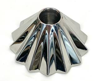 Lot # 8	$25.00	GEORG JENSEN "SUPERNOVA" SINGLE CANDLE HOLDER, SIGNED	Height, 2.0 in., diameter 4.5 in. Candle Holder with faceted finish, reminiscent of glass dessert plates references contemporary aesthetics and materials as well as traditional craftsmanship. Designed by Rebecca Uth from the Danish Design School in Copenhagen with specialization in product design in 2000. 	Bid at Woodardlipe.com or call 314-899-0098 for more information.