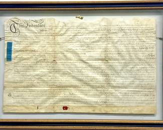 Lot # 74	$250.00	18TH CENTURY ENGLISH INDENTURE ON VELLUM WITH WAX SEAL	Sight height 16.5 in, width 27 in., Frame height 22.5 in, width 32.5 in. Hand written indenture on goat vellum dated 1735 under the reign of King George II.  The subject of indenture is an "Act to Enlarge the Port and Harbour or Scarborough in the County York" and sets forth transactions of all duties and monies.  Wax Seal, mounted between two glass sheets.  Excellent condition of parchment and of frame.	Bid at Woodardlipe.com or call 314-899-0098 for more information.