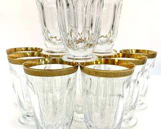 Lot # 58	$500.00	SET 12 MOSER CRYSTAL "LADY HAMILTON" 24K GOLD RIMMED WATER GLASSES	Height 5.5 in, width 3.5 in. Czechoslovakian crystal wine glasses in the "Lady Hamilton" pattern, some with original "Moser" sticker on the base. The Lady Hamilton drinkware collection was conceived nearly 100 years ago as a tribute to the beautiful woman with a powerful fate – Emma Hamilton – and ever since, it’s enjoyed the continuous favor of the most demanding customers from all over the world, including the Sultan of Morocco Muhammad V, the Iranian Shah Mohammed Reza Pahlavi, and the Maharaja of Travancore, among others. (Two glasses have slight chip in rim.)	Bid at Woodardlipe.com or call 314-899-0098 for more information.