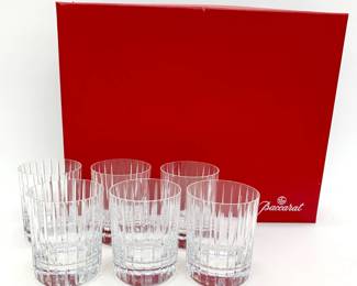 Lot # 64	$400.00	BACCARAT HARMONIE TUMBLER COCKTAIL GLASS SET (6)	"Height 3.75 in., diameter 3 in.;  A perfect vessel to enjoy smooth mixed drinks or your favorite whiskey. The tumbler's size and weight are quite substantial, making it a popular barware glass and best seller for the brand. Characterized by the Harmonie collection’s signature look, these tumblers feature vertical cuts traveling lengthwise up the clear crystal from base to top. This creates a subtle texture and adds a feeling of depth to the glass and the drink within. Condition, Very Good; no chips to either the rim or base, clear and unetched.
Bid at Woodardlipe.com or call 314-899-0098 for more information.