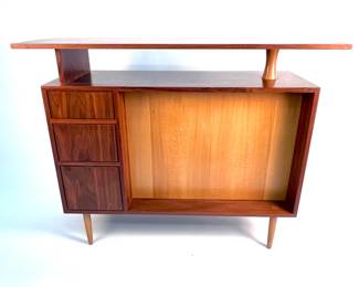 Lot # 98	$1,800.00	CUSTOM WALNUT, CHERRY, AND MAPLE BAR CABINET BY ST LOUIS FURNITURE DESIGNER, MARTIN GOEBEL	Width 52 in., height 42 in., depth 18 in., Custom Hospitality Bar in Mixed Woods by St. Louis Furniture designer Martin Goebel. Condition; like new.	Bid at Woodardlipe.com or call 314-899-0098 for more information.