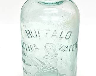 Lot # 5	$25.00	BUFFALO LITHIA SPRINGS 19OO MINERAL WATER GLASS BOTTLE	"Height 10 in., diameter 4.5 in. Antique Buffalo Lithia Water Bottle
in light aqua glass with raised lettering. Buffalo Lithia Water (later Buffalo Mineral Springs Water) was a brand of lithia water bottled in Buffalo Lithia Springs, Virginia. It was advertised as able to treat fevers and nervous disorders and was sold from the late 19th century to the early 20th. At the height of its popularity, it was available in approximately groceries and pharmacies in Europe, Canada, and the United States."	Bid at Woodardlipe.com or call 314-899-0098 for more information.