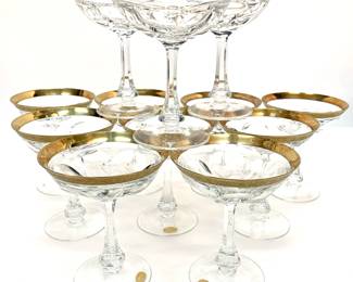 Lot # 57	$500.00	SET 12 MOSER CRYSTAL "LADY HAMILTON" 24K GOLD RIMMED CHAMPAGNE COUPE/DESSERT GLASSES	Height 5 in, width 4.25 in. Czechoslovakian crystal wine glasses in the "Lady Hamilton" pattern, some with original "Moser" sticker on the base. The Lady Hamilton drinkware collection was conceived nearly 100 years ago as a tribute to the beautiful woman with a powerful fate – Emma Hamilton – and ever since, it’s enjoyed the continuous favor of the most demanding customers from all over the world, including the Sultan of Morocco Muhammad V, the Iranian Shah Mohammed Reza Pahlavi, and the Maharaja of Travancore, among others. One glass with slight chip in gold rim (as shown in photograph)	Bid at Woodardlipe.com or call 314-899-0098 for more information.