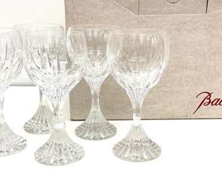 Lot # 63	$400.00	BACCARAT CLEAR CRYSTAL MASSENA WHITE WINE GLASS SET (6)	Height, 7 in., diameter 3 in.; Baccarat Massena Champagne Flute is fully crafted by hand, showcasing Baccarat’s craftsmanship to the fullest. Deep orgue bevel cuts are etched into the clear crystal, running from the foot of the glass to the base of the bowl. The upper half of the flute’s polished silhouette stands out in sharp relief to the detail below. Original packaging. Condition, Very Good; no chips to either the rim or base, clear and unetched.	Bid at Woodardlipe.com or call 314-899-0098 for more information.