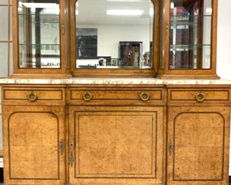 Lot # 93	$1,400.00	NEVRET AND LAMBERT, PARIS, LATE 19TH CENTURY FRENCH MARBLE TOP SIDEBOARD MIRRORED CABINET WITH MAPLE BURLWOOD VENEER 	Height 74in, width 66.25 in, depth 20.75 in. This cabinet has maple burlwood veneer with brass hardware and brass ormolu detailing with two curio style cabinets on the right and left side,  supported by a slab of beveled stone. The back mirror is beveled and the entire cabinet has additional inlay detailing. Originally sold by Nevret and Lambert, Paris; two skeleton keys accompany. Condition excellent, marble shelf is completely intact. no issues with missing veneer and structure is sound, no chip to glass.	Bid at Woodardlipe.com or call 314-899-0098 for more information.