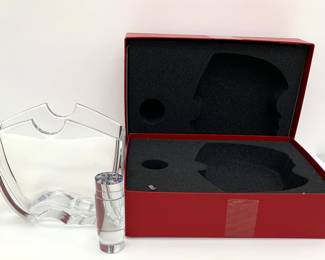 Lot # 65	$200.00	THOMAS BASTIDE FOR BACCARAT OCEANIE VASE WITH MILLEFIORI ROD	"Height 8.75 in., width 8.0 in., depth 3.75 in. Baccarat Oceanie Vase by Thomas Bastide shows the exquisite craftsmanship and detail of fine glass design. The Millefiori Rod alone is an Italian style masterpiece of rod and canework, a beautiful color study and masterfully polished. Original packaging. Condition, Very Good; no chips to either the rim or base, clear and unetched.
Bid at Woodardlipe.com or call 314-899-0098 for more information.