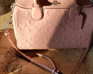 Pale Pink Coach shoulder strap and handles
