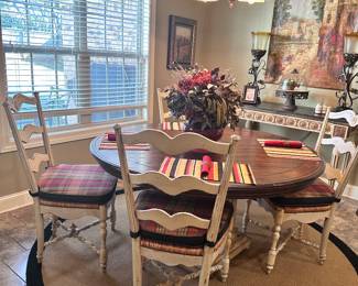 Heavy well built round table w/off white distressed support and 5 matching off white mildly distressed chairs 
In fantastic shape with one leaf 
59” round without leaf 
$599