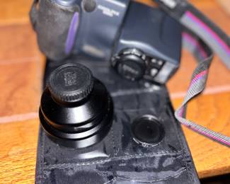 Accessories to camera, lenses included