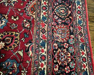 Richly colored room size carpet- 16’6” x 11’9”