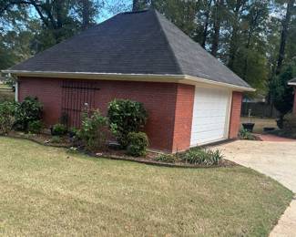 brick side garage loaded with goodies and treasures