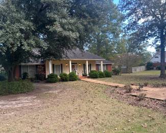 view of front of custom built home in beautiful neighborhood in great subdivision in Aberdeen, ms