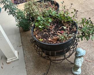black planters and decorative metal bases