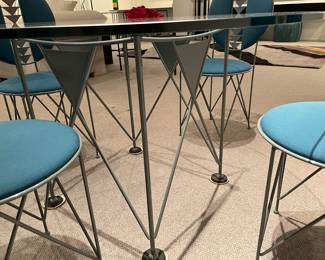 another view of the Ltelier international - limited - Italian round glass game table and steel base (28.5" x 47") with 4 chairs - all pieces are in excellent condition