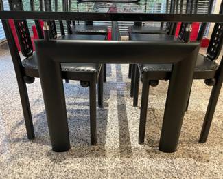 Black steel and glass dining table by Cassina after Le Corbusier - excellent condition (28" x 88" x 39.5") and shown with black leather and and metal side chairs (6) designed after Joseph Hoffman (39.25" x 17.5" x 17.5")